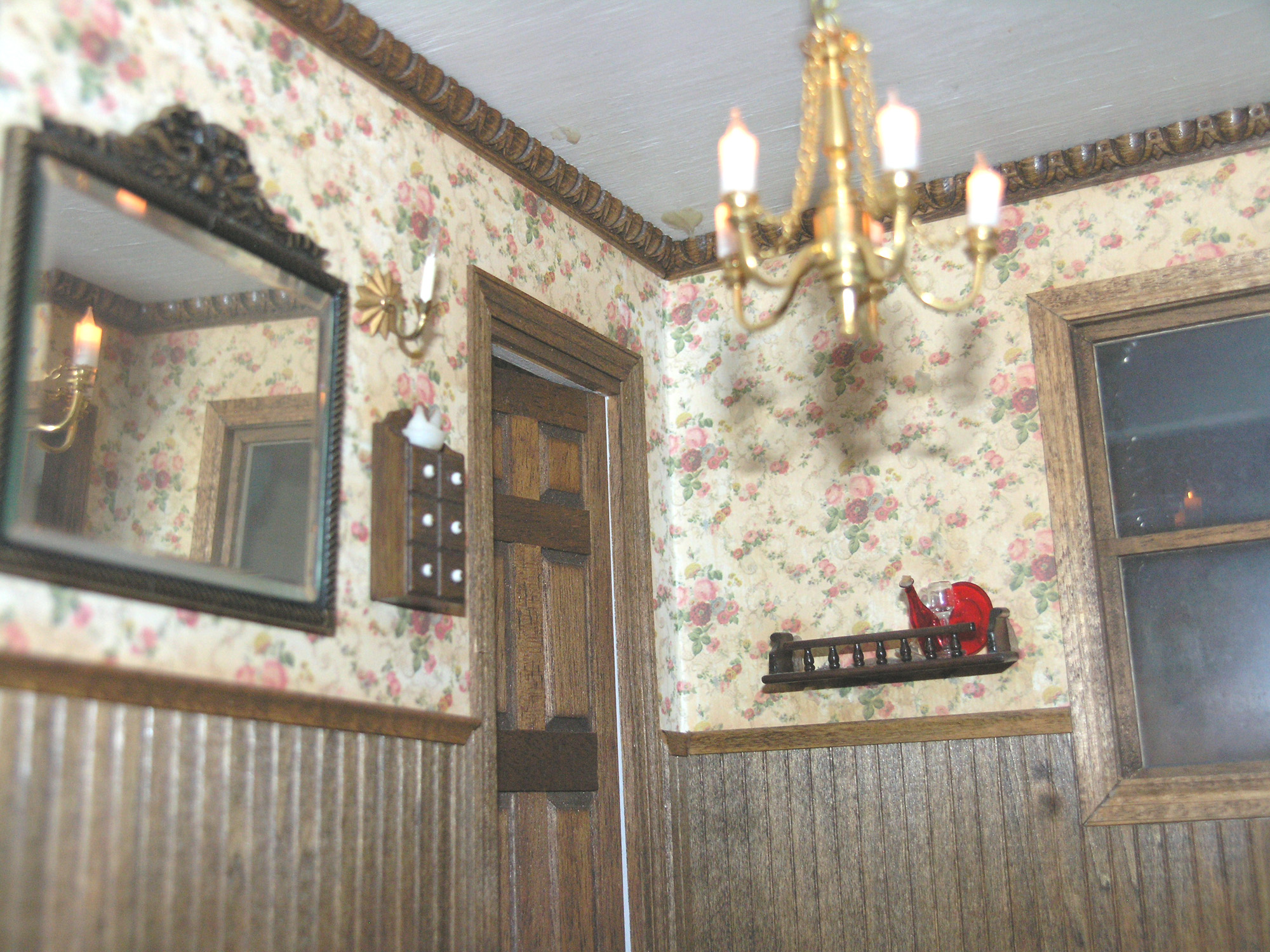 INTERIOR of the new dollhouse at Benicia Historical Museum. The house is electrified, giving the tiny lamps their glow. Photos by Keri Luiz/Staff