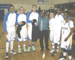 BENICIA HIGH’S boys basketball program honored its six seniors before Tuesday night’s season finale against American Canyon. Pictured are (from left) J.T. Vosley-Hodge, Eric Voss, Derek Johnstone, varsity head coach Steve Carter, D’Angelo Cronin, Marcus Turner and James Hyde Jr.