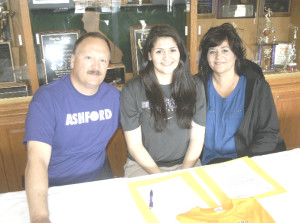 SPSV’S MICHAELA GARDNER (center) accepted a full-ride scholarship offer to play volleyball for Ashford University in Clinton, Iowa. Pictured with Gardner are her father and mother – Fred (left) and Diane.