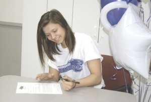 BENICIA’S ALYSSA GONZALEZ signs her scholarship offer to wrestle for McKendree University in Illinois.
