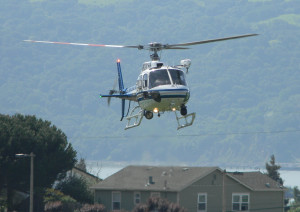 A CALIFORNIA HIGHWAY PATROL helicopter approaches Benicia High School's campus during Tuesday's "Every 15 Minutes" alcohol-related fatal crash simulation.