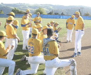 BENICIA MANAGER Jim Bowles praises his baseball team after a 18-0 thumping of Vallejo on Thursday.