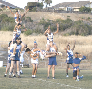 THE SENIOR BOYS put on their own show dressed as the school’s cheerleading squad.