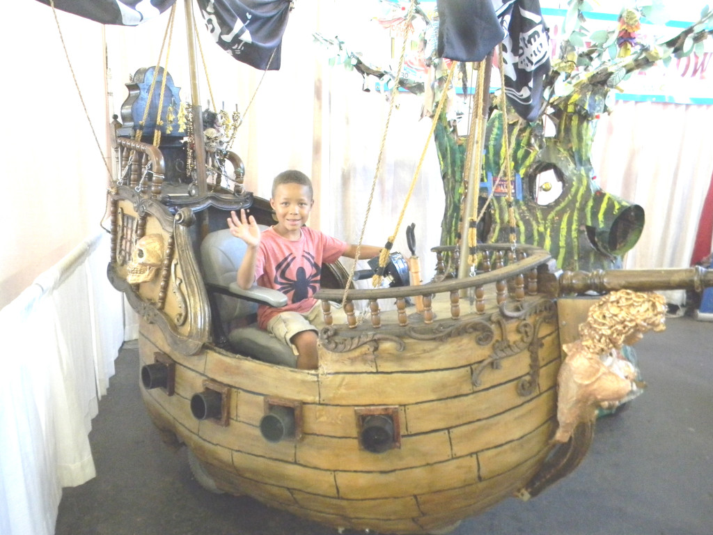 MICAH MINTER, 5, of Vallejo, handles a pirate ship "contraption" vehicle in Vallejo's display at the Solano County Fair. Donna Beth Weilenman/Staff  