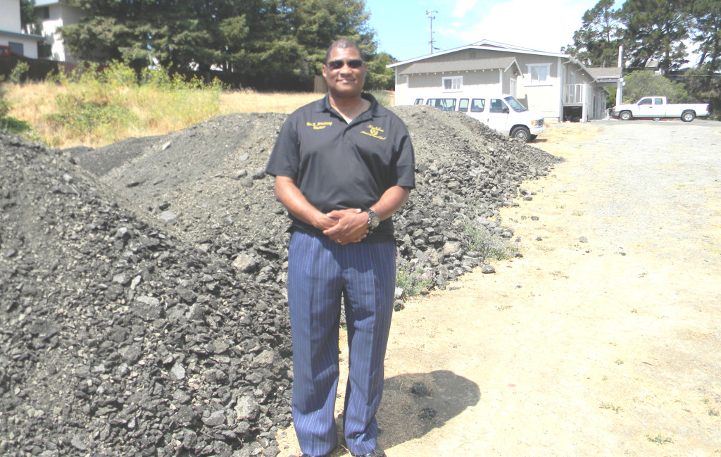 THE REV. ARMSTRONG in King Solomon's soon-to-be-finished parking lot. 