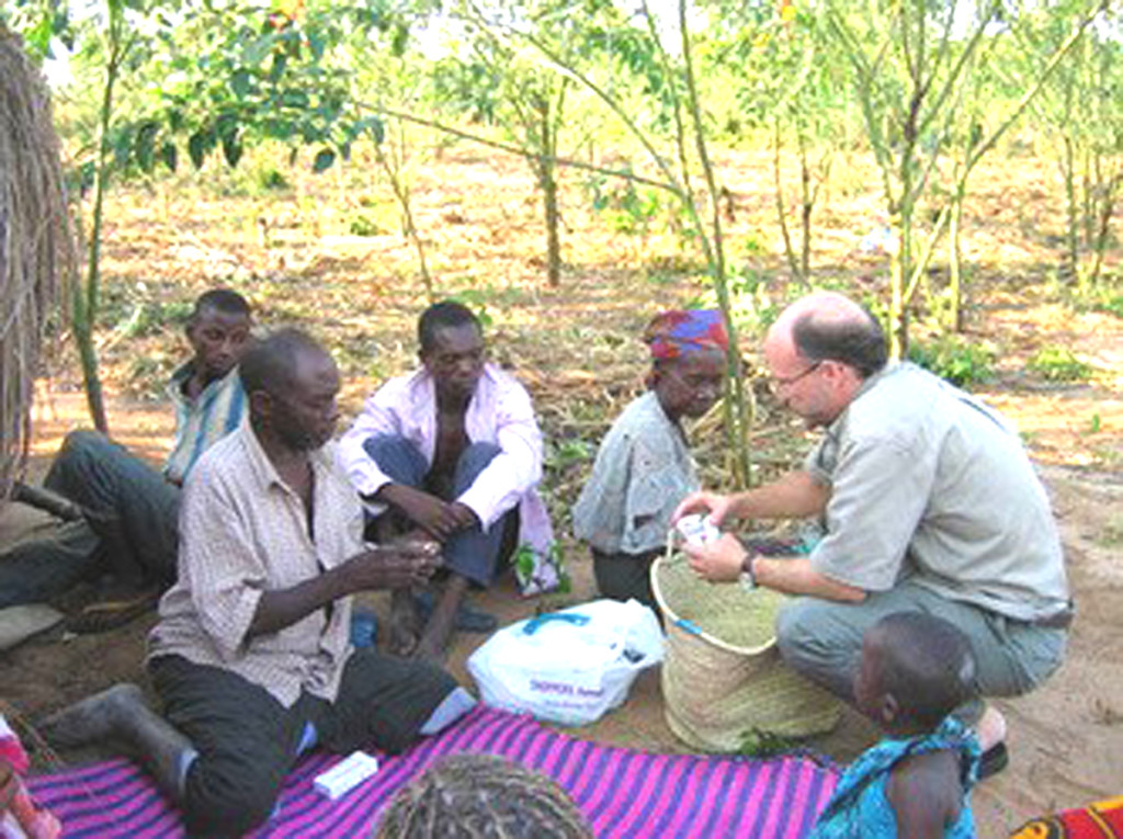 DR. JOEL CARPENTER, right, during one of his regular medical visits to communities around Tanzania, where he runs a clinic that treats hundreds daily. Courtesy photos