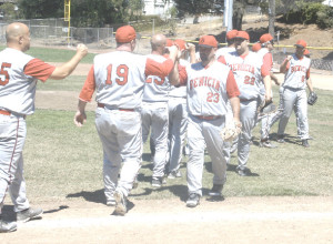 THE BENICIA OLDTIMERS celebrate after going 3-0 at last weekend’s Dutch Van Wey Classic, earning a berth into this weekend’s NorCal semifinals at Fitzgerald Field.