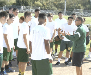 NEW SPSV varsity football head coach Lane Hawkins (right) is conditioning his small squad of Bruins for a grueling 2014 season.