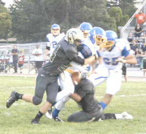 BENICIA RUNNING BACK Alex Osterholt has the ball stripped by the Concord defense.