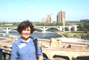 MAYOR ELIZABETH PATTERSON standing outside a “grain” elevator in the Mills Town Museum.