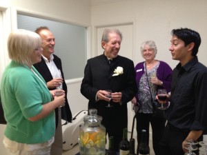 DAVID REQUIRO, right, and Maestro David Ramadanoff, center, at a post-concert reception Sunday at McCree-Goodeau Gallery. S. Peterson photo