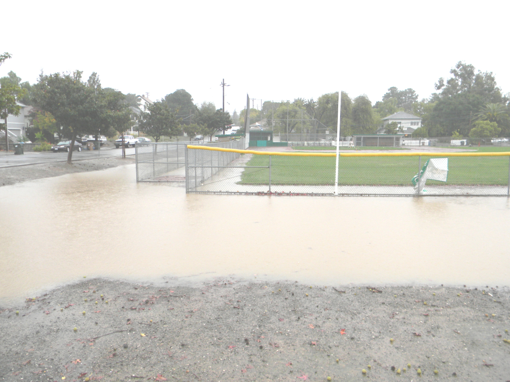 RAIN COLLECTED into a pond Thursday at the ball fields at Third and H streets. Donna Beth Weilenman/Staff