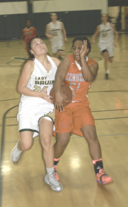 SPSV’S SELENA CAOILE (left) gets tangled up with Kennedy’s Destanee Alexander on her way to the basket.