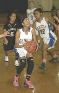 KAMERON HATCHER of Benicia goes strong to the basket against visiting American Canyon.