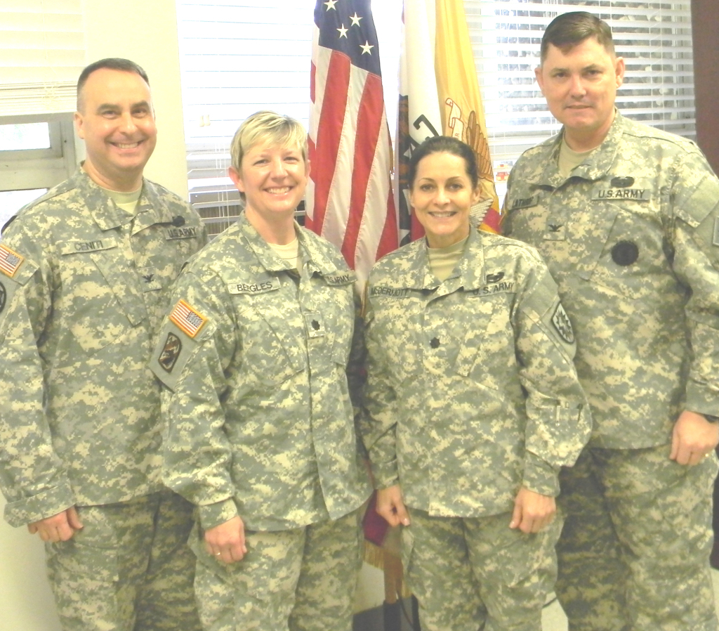 LT. COL. Barbara J. Beegles, second from left, poses with former CSSB commander Col. David A. Ceniti, left, outgoing commander Lt. Col. Donna A. McDermott and Col. John Lathrop at the conclusion of the change-of-command ceremony Sunday.