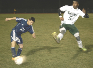 SPSV’S MARQUIS PERRILLIAT (right) comes flying in hoping to get the ball from Pinole Valley’s David Hernandez.