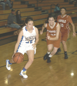 BENICIA’S EMMA WARD (left) turns the corner against Fairfield’s defense during Thursday night’s overtime victory.