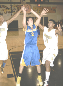 PETER KOENEN (2) threads his way through the Bethel defense for a shot during Benicia’s 68-63 double-overtime victory Tuesday night.