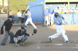 BENICIA’S DAVID KING tears into a pitch against Deer Valley. King had two of Benicia’s six hits in an extra-innning defeat.