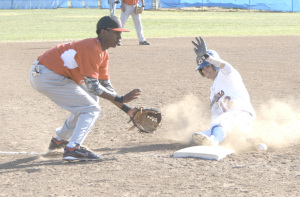 JACK BOWLES (right) steals third base for the Panthers against Vallejo.