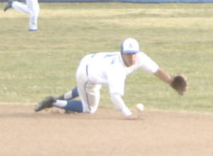 SECOND BASEMAN Anthony Altman dives to try and stop a ball against Rodriguez.