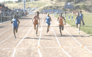 BENICIA HIGH’S Milyan White (far left) wins the varsity girls 100 meters as teammates Kameron Hatcher (middle) and Britiana Fields-Strother (far right) compete in Wednesday’s finals.