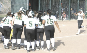 CHELSEA MARI (far right) is about to get mobbed by her teammates after hitting a walk-off home run in the TCAL semifinals.