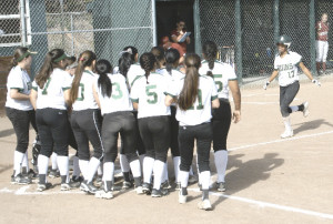 LADY BRUINS gather at home plate to congratulate Neenah Pangilinan after the sophomore hit a home run in Friday’s North Coast Section Division IV quarterfinals.