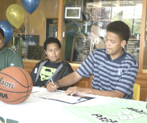 RYAN STEWART signs a letter of intent to play basketball for Whitman College after graduating from SPSV.