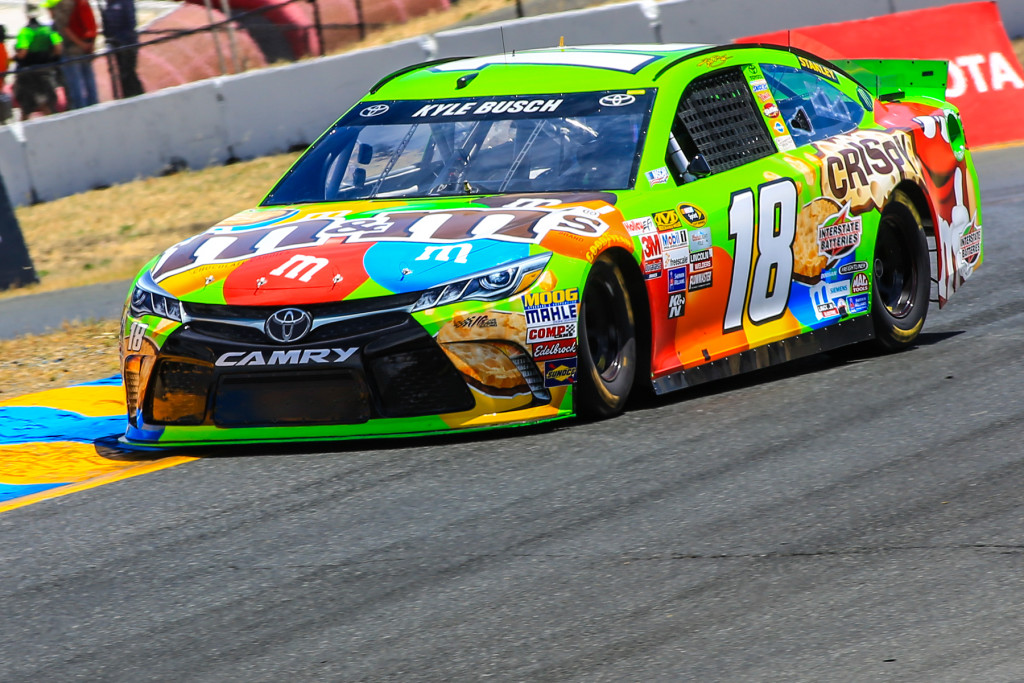 KYLE BUSCH crosses the finish line first Sunday in front of his brother, Kurt Busch. Malcolm Slight/Special to The Herald