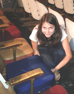 BENICIA GIRLS SCOUTS’ Isabel Blaettler shows off the snug fit of the new seat covers at the Majestic Theatre.