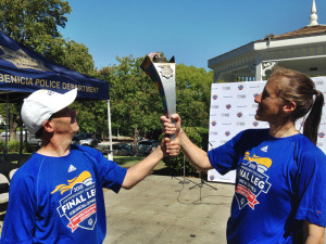 Jonathan Sparks of Elk Grove  holds the Special Olympics torch with Nancy Howell  of the Royal Canadian Mounted Police from Newfoundland and Labrador, Canada. Photo by Donna Beth Weilenman, staff. 