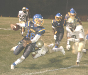 BENICIA QUARTERBACK Devin Holden (16) tries to get away from Concord defenders.