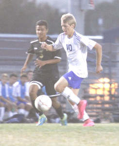 LANDON ELFSTROM raced through the American Canyon defense for two goals and an assist as Benicia High’s boys varsity soccer team won its Solano County Athletic Conference opener Wednesday night. (photo by Eric Breganza)