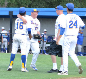 BENICIA PITCHER Anthony Lopez (23) gets congratulated by teammates after his three-hitter sent the Panthers to the Sac-Joaquin Section Division II championship game.
