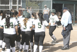 JAYDEE BOURSAW (22) gets met at home plate by her SPSV teammates after hitting a mammoth two-run homer in Tuesday’s North Coast Section playoff opener.