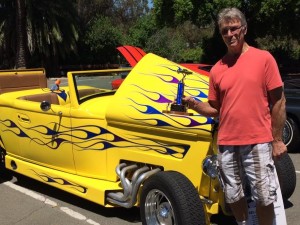 Cancer survivor Tim Merrill poses with the Best in Show trophy he and his wife Laurie won for their Chrysler Hot Rod at the "Cruzin' and Cookin' for a Cure" event Saturday. Proceeds helped beneft Benicia and Vallejo's relays for life. (Photo courtesy of Kate Gibbs)