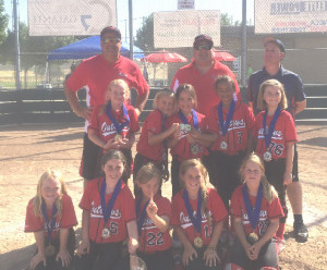 THE 8-UNDER OUTLAWS took first place at last weekend’s Piece of the Rock Tournament in Rocklin. The 8-under Outlaws are (back row from left) coaches Steve Walling, Ed Rojas and Chris Thomsen; (middle row) Cierra Ray, Alyson Walling, Ava Rojas, Alana Robinson, Emily Shedoudy; (front row) Christina Thomsen, Emma French, Olivia Kundysek, Kylie Ladner and Vanessa Smith.