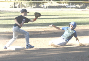 PEYTON ROWLES (left) and Luca Carmichael (sliding) will make their Benicia all-star debuts Saturday at the District 53 Tournament in American Canyon.