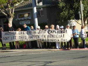 Members of Benicians for a Safe and Healthy Community gathered at the corner of Military and East 2nd Street Tuesday to raise awareness of risks from crude oil transport by rail, in response to the weekend derailment and explosion along the Columbia River in Oregon. (Photo by Elizabeth Warnimont)