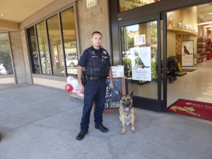 Benicia officer Jake Heinemeyer and his canine partner Atos were on hand at Pet Food Express over the weekend in support a weekend fundraiser for the non-profit "Cover Your K9." (Photo courtesy of Pet Food Express)