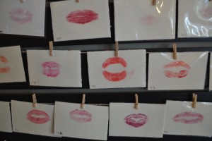 Lip imprints on display at Jave Point Cafe, where visitors can press their lips against a piece of paper and have it be hung on "The Great Wall of Lips." This artwork is a promotion for Catherine McSharry's new musical "Lefty and Liela Get it Right," which will be performed at PianoFight in San Francisco on Aug. 13 and 14. (Photo by Nick Sestanovich)