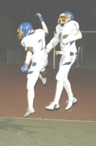 XAVIER JUDKINS (right) and Cavon Etter celebrate after Judkins caught his second touchdown of the night against Armijo.