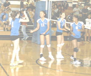 LADY PANTHERS (from left) Natalie Sluga, Darian Dudley, Jessica Blakeman and Reagan Lewis celebrate a point against St. Patrick-St. Vincent on Wednesday.