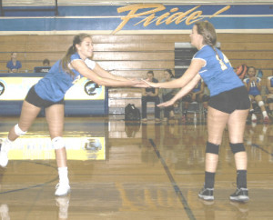 BENICIA HIGH’S Jessica Blakeman (left) and Karah Fisher celebrate a point against Fairfield.