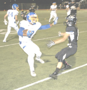 CAVON ETTER of the Panthers (left) stiff-arms an American Canyon defender.