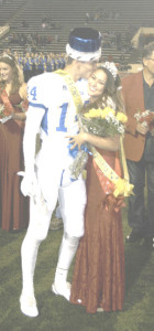 BENICIA HIGH’S Mario Ferreira (14) gives Jenalynn Beard a kiss after the couple were crowned Homecoming King and Queen on Friday in Vallejo.