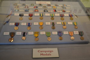 A display case of war medals is one of features in the Benicia Historical Museum's new permanent exhibit "Benicia Arsenal in War and Peace." (Photo by Nick Sestanovich)