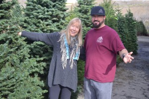 Elizabeth d'Huart, the executive director of Benicia Historical Museum (Left), and Joel Ryan, the clinical manager of Genesis House, pose with the newly arrived firs for the museum's annual Christmas Tree Lot Fundraiser, which opens Friday, Nov. 25. (Photo by Nick Sestanovich)