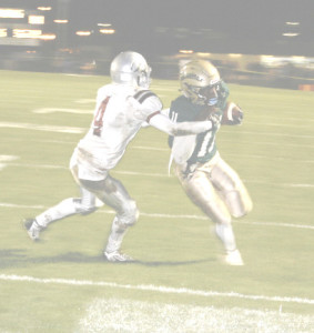AKIL EDWARDS of SPSV (right) gets away from St. Francis defender Efren Magana and scores on a 5-yard touchdown run.
